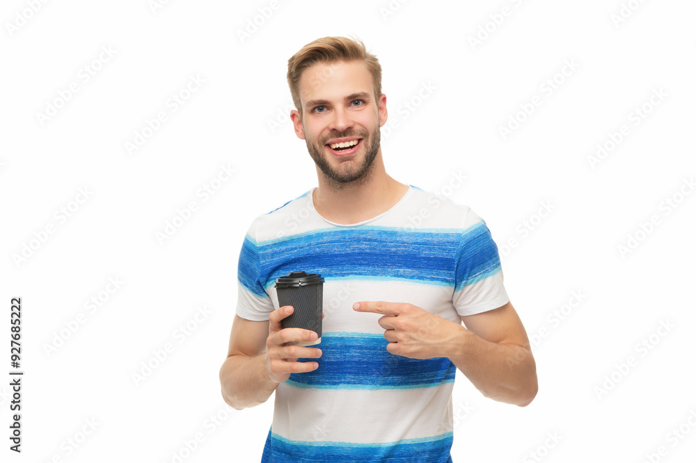 Millennial man enjoying cup of coffee. Young man in casual t-shirt holding paper cup of coffee. Drink hot tea in morning isolated on white. Man relaxing with coffee. Takeaway coffee cup. Point finger Millennial man enjoying cup of coffee. Young man in casual t-shirt holding paper cup of coffee. Drink hot tea in morning isolated on white. Man relaxing with coffee. Takeaway coffee cup. Point finger