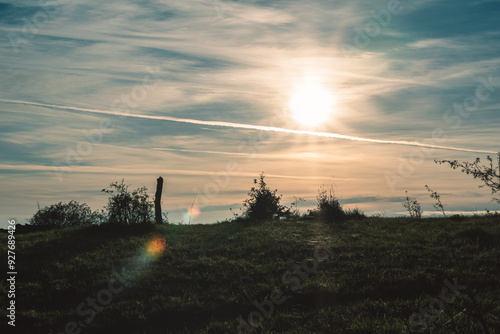 dramatic scenis yellow orange sunset in the meadow, photo