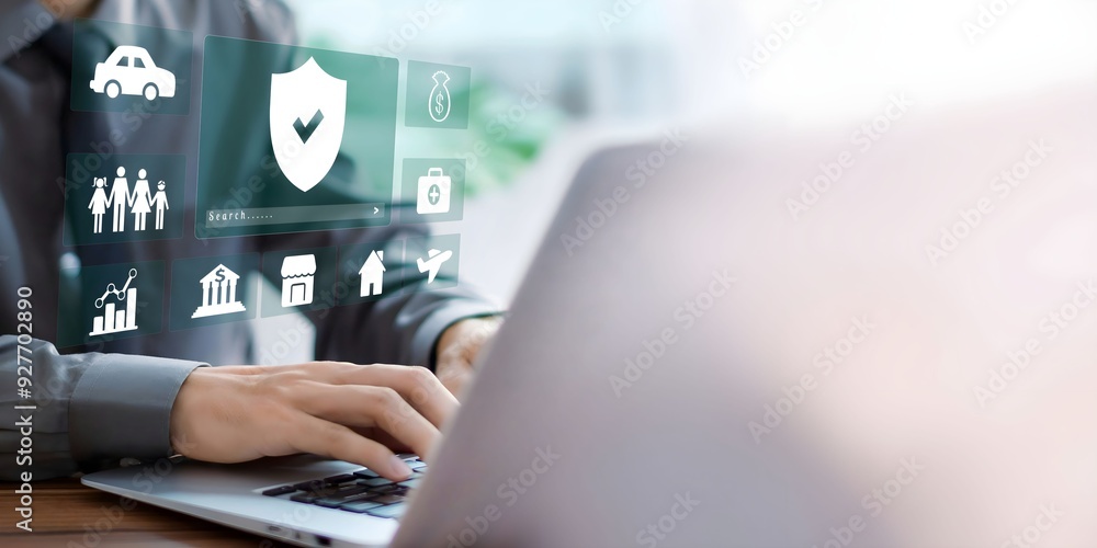A businessman using laptop with insurance concept on visual screen for health, real estate, store, bank, family and transport icons. A businessman using laptop with insurance concept on visual screen for health, real estate, store, bank, family and transport icons.