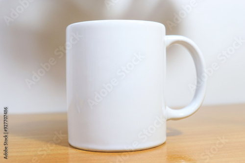 white cup on wooden table