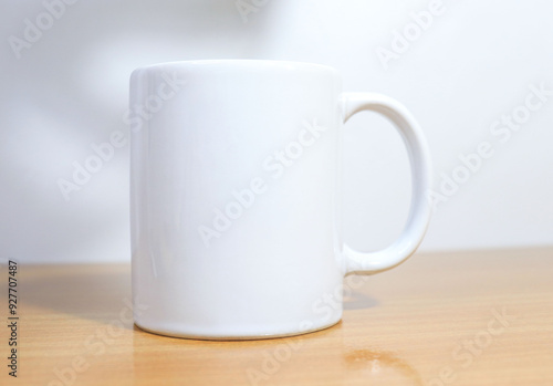 white cup on wooden table