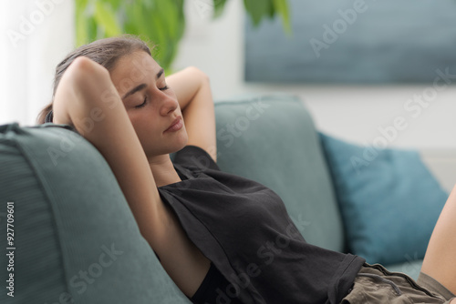 Beautiful adolescent girl resting at home