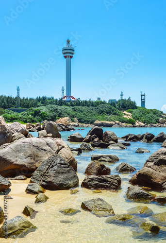 beautiful tropical landscape of Mulan lighthouse and sea & ocean at Mulan Bay, Wenchang, Hainan, China photo