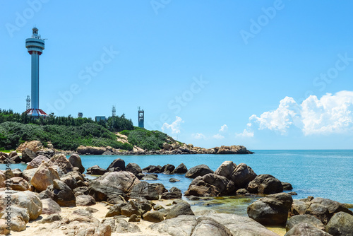 beautiful tropical landscape of Mulan lighthouse and sea & ocean at Mulan Bay, Wenchang, Hainan, China photo