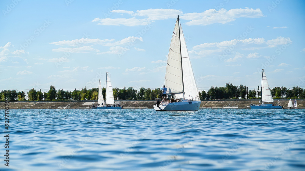 Fototapeta premium Sailboats compete in a sail regatta, race of sailboats