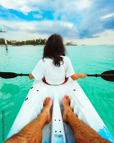 POV Couple Kayaking in the Ocean on Vacation in Maldives. Fulidhoo island coastline and sports activities photo