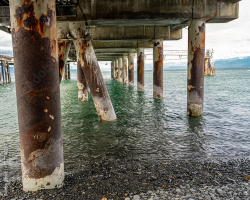 Sea harbor dock pilons and ocean photo