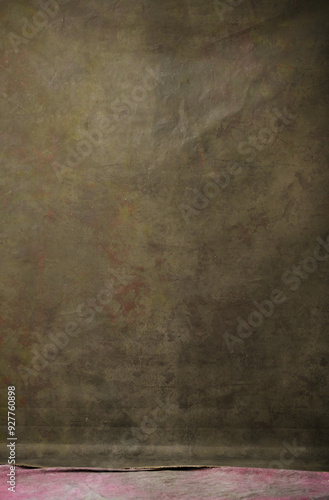 Greenish vintage canvas backdrop in a studio