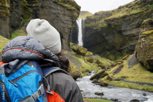 Valokuva Hiker man arriving at a landscape with impressive waterfall in Iceland