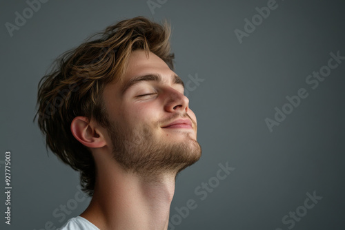 A close up of a man's face with his eyes closed