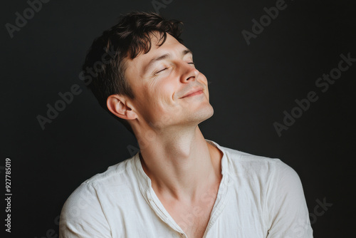 A close up of a man's face with his eyes closed