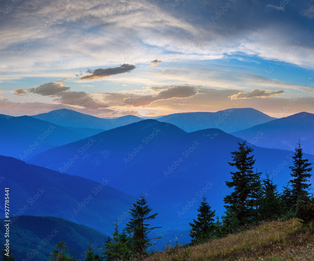 Obraz premium Mountain outline on evening sky (with clouds) background. Summer sunset twilight view (Carpathians, Ukraine).