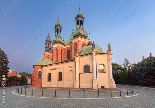 Cathedral of St. Peter and Paul in Poznan at dawn with Gothic towers in soft morning light.