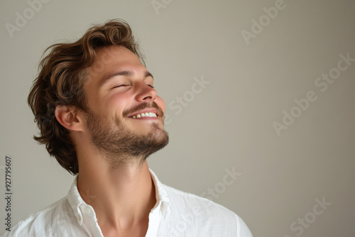 A close up of a man's face with his eyes closed