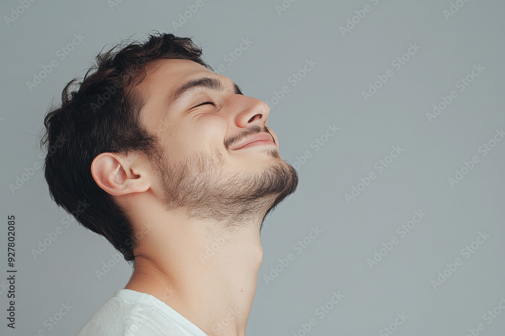 Obraz premium A close up of a man's face with his eyes closed