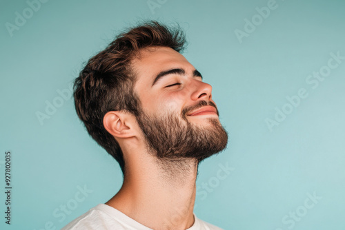 A close up of a man's face with his eyes closed