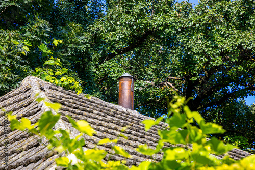 Exhaust pipe on the roof of the house for smoke extraction.. photo