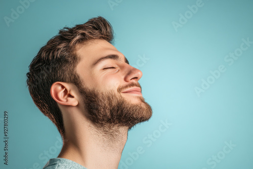 A close up of a man's face with his eyes closed