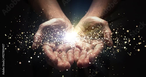 Hands, praying and lights shine for enlightenment, magic or spiritual realm on black background. Person or astrologer for hope, future or fortune telling with bokeh glow for palm reading in astrology photo