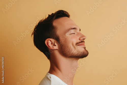 A close up of a man's face with his eyes closed