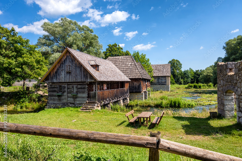 Wonderful Majerovo Vrilo, old mill houses and bridges made from wood and stone in the village of Sinac, Croatia, built around Gacka river source Wonderful Majerovo Vrilo, old mill houses and bridges made from wood and stone in the village of Sinac, Croatia, built around Gacka river source