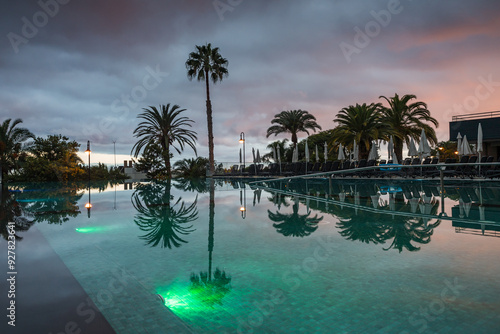 Reflections of sunset on a swimming pool photo