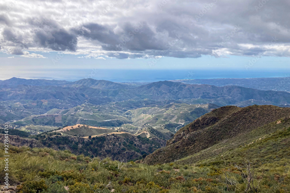 Fototapeta premium Panoramic view from hiking trail to Maroma peak in thunderstorm day, Sierra Tejeda, Spain 