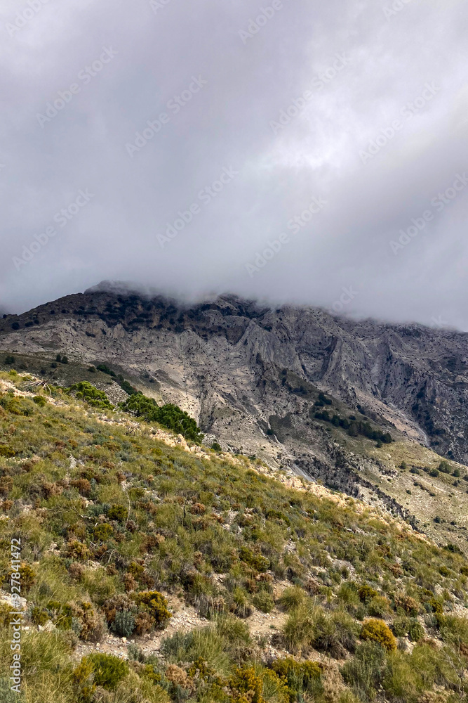 Fog and clouds on hiking trail to Maroma peak in thunderstorm day, Sierra Tejeda, Spain Fog and clouds on hiking trail to Maroma peak in thunderstorm day, Sierra Tejeda, Spain