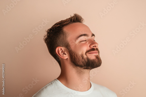 A close up of a man's face with his eyes closed