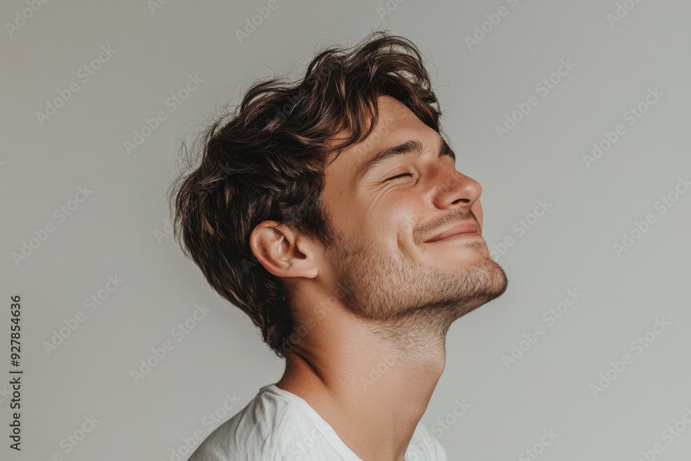 A close up of a man's face with his eyes closed