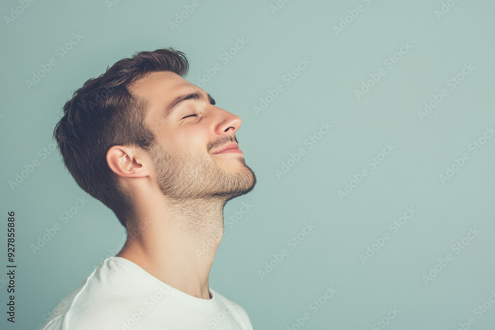 Obraz premium A close up of a man's face with his eyes closed