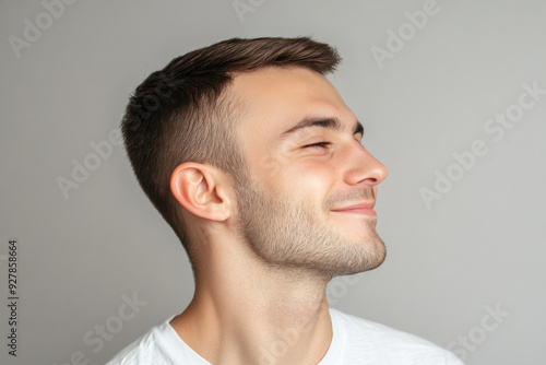 A close up of a man's face with his eyes closed