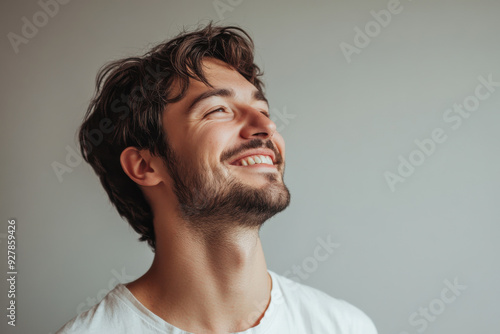 A close up of a man's face with his eyes closed