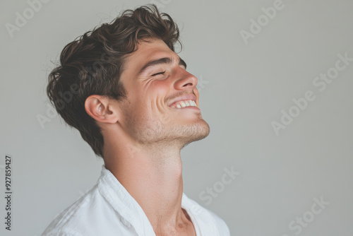 A close up of a man's face with his eyes closed