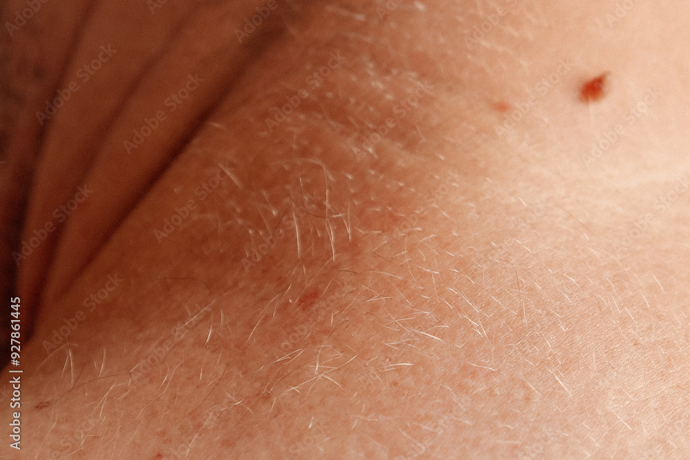Fototapeta premium Detailed shot of a neck showing a mole, highlighting the natural skin surface and imperfections.