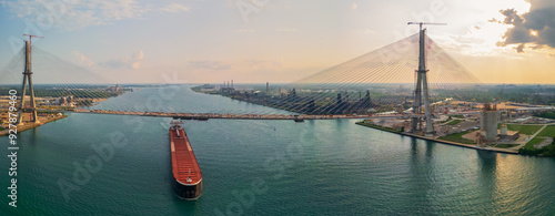 A barge under newly constructed Gordie Howe International Bridge across the USA and Canada border at Detroit downtown.