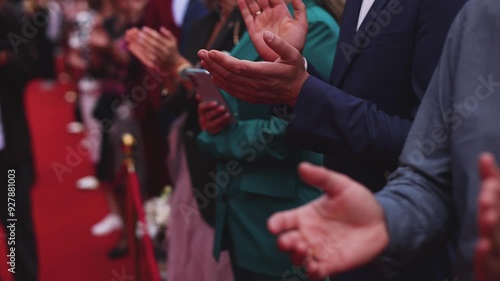 Red carpet with ropes and golden barriers on a luxury party entrance, cinema premiere film festival event award gala ceremony, wealthy rich guests arriving, outdoor decoration elements, summer day