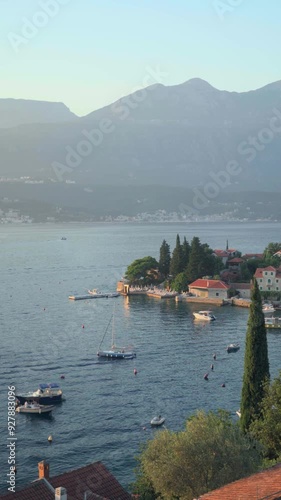 Rose, Montenegro. View of the bay, harbour and mountains at sunset