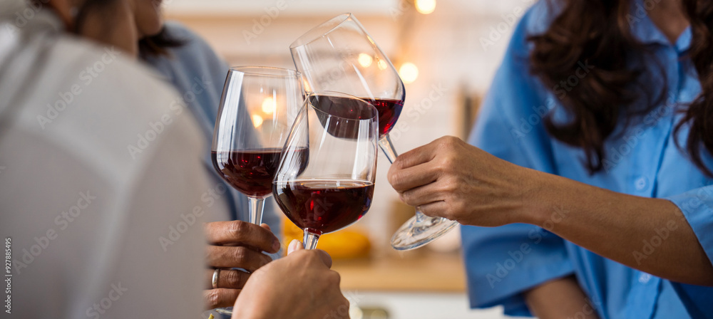 Friends Cheers wine glasses in kitchen. Reunion friendship greeting concept holidays, party and celebration concept Friends Cheers wine glasses in kitchen. Reunion friendship greeting concept holidays, party and celebration concept