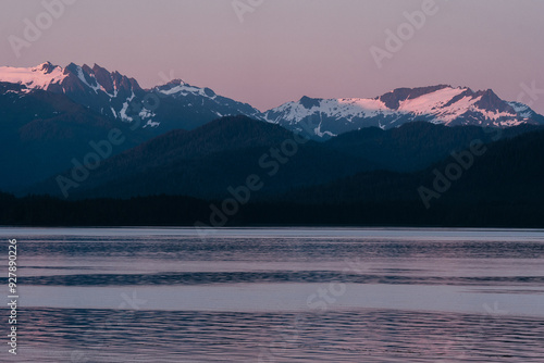 Sunset on mountain range along Southeast Alaskan coastline along the inside passage in summer