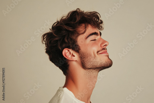 A close up of a man's face with his eyes closed