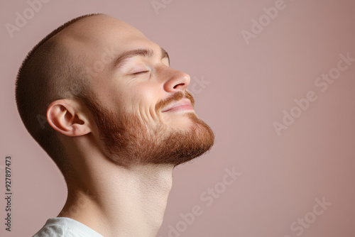 A close up of a man's face with his eyes closed