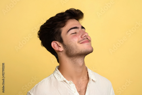 A close up of a man's face with his eyes closed