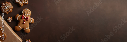 Sweet handmade gingerbread man cookies for Christmas and New Year holiday. Festive background for greeting card, banner, poster. Flat plan, top view with copy space