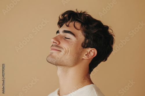 A close up of a man's face with her eyes closed