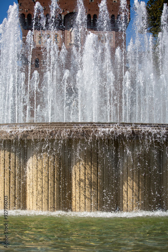 Water fountains in front of Sforza Castle (Castello Sforzesco), Fontana di Piazza Castello, Milan, Italy