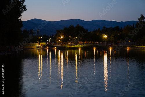 Evening lanterns as reflection in park in greece. quite evening with calm lights 