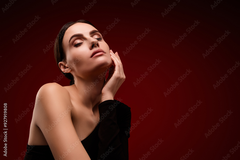 Photo of tender girl with closed eyes feel soft skin on face isolated red color background Photo of tender girl with closed eyes feel soft skin on face isolated red color background