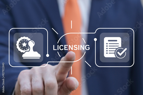 Obraz na płótnie Business man using virtual touch interface presses word: LICENSING. License agreement business technology concept. Copyright protection law license property rights. w salonie