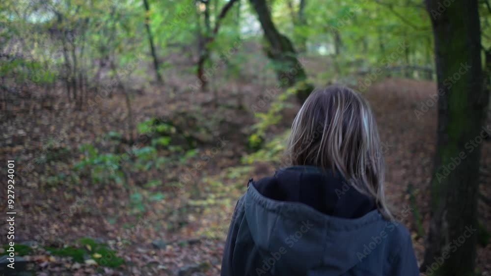 Unrecognizable Woman Walking in Autumn Forest